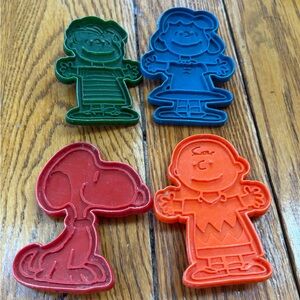 Charlie Brown Peanuts plastic cookie cutters.  Good condition. Set of four.